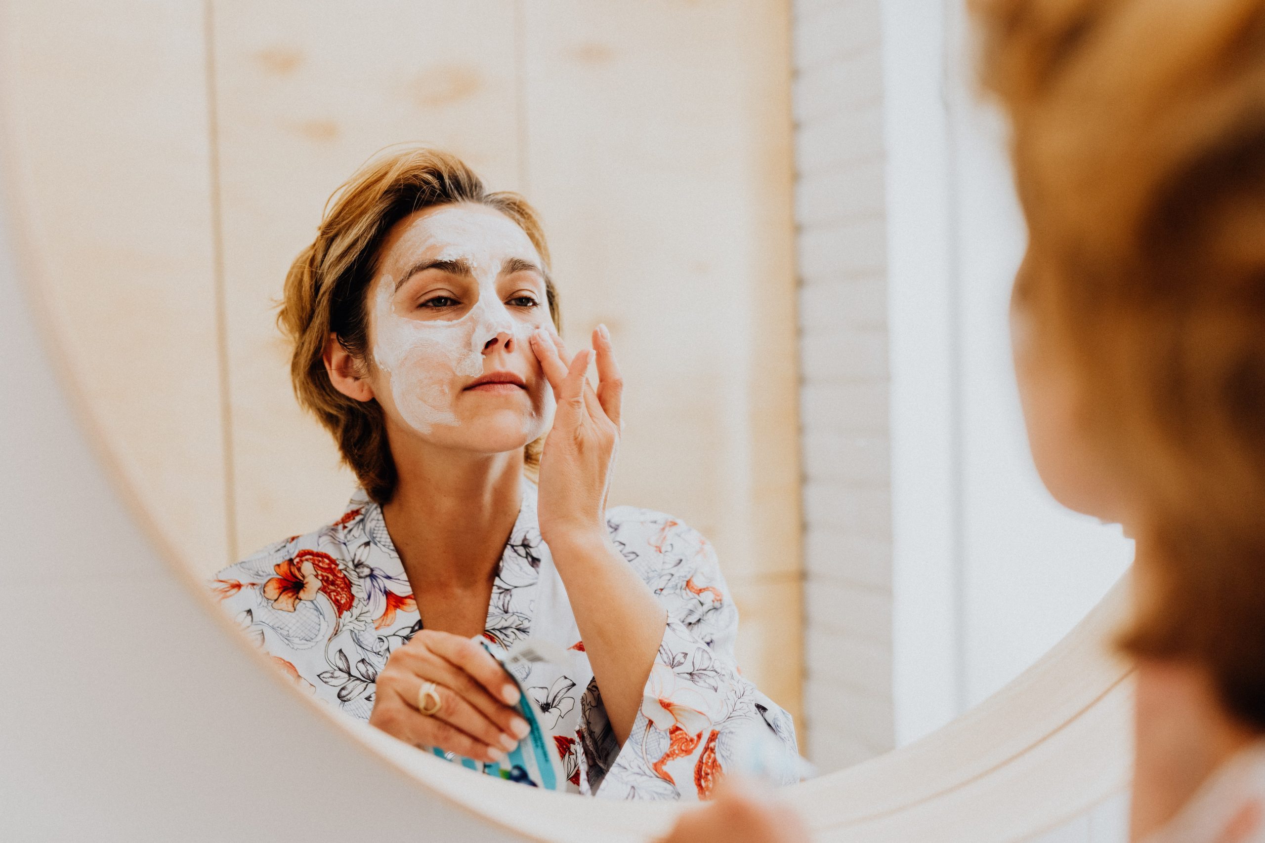 woman washing her face